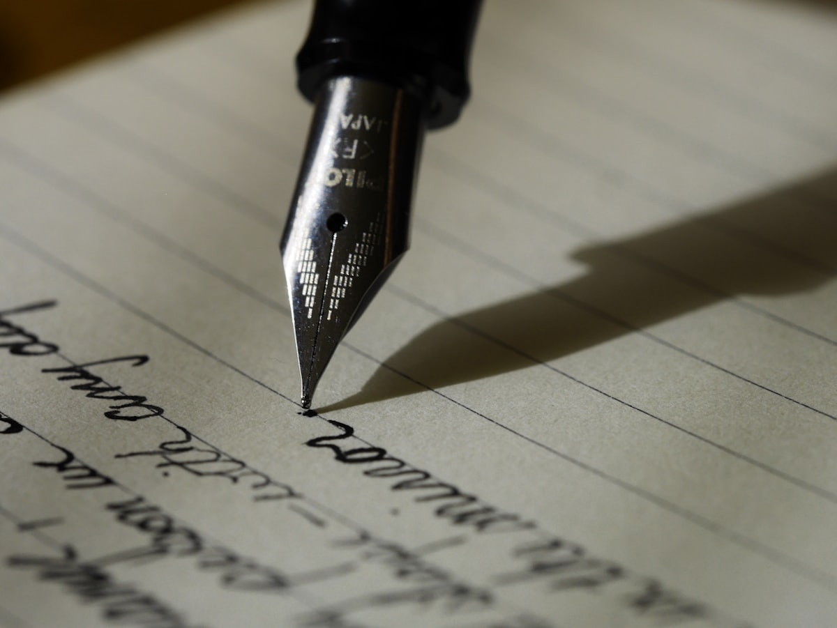 words of affirmation love language — woman smiling reading a heartfelt note