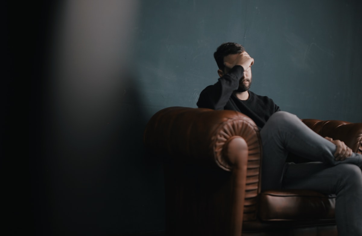 8 signs of anxious attachment style — woman looking worried in relationship