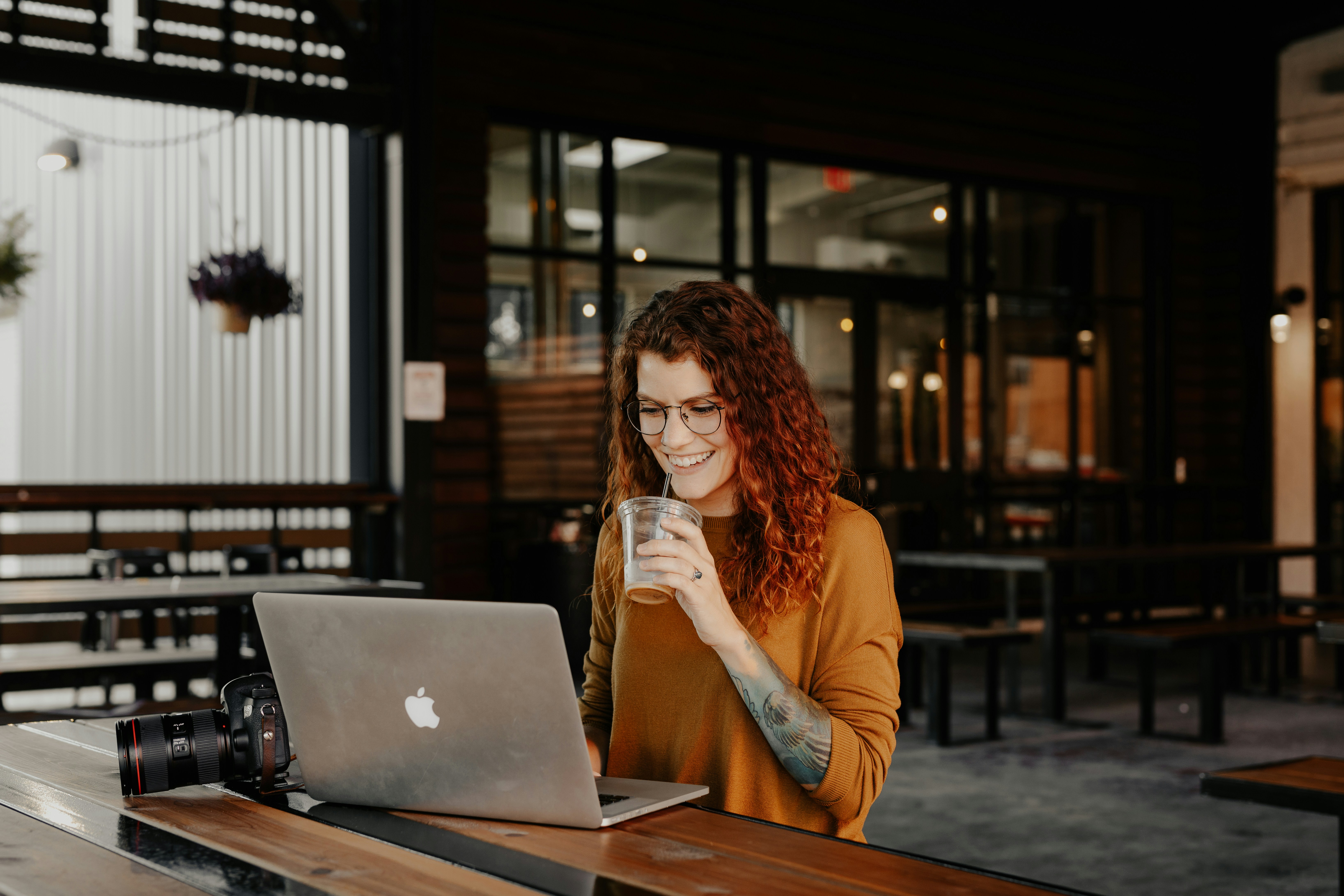 woman using laptop for online therapy session betterhelp or talkspace