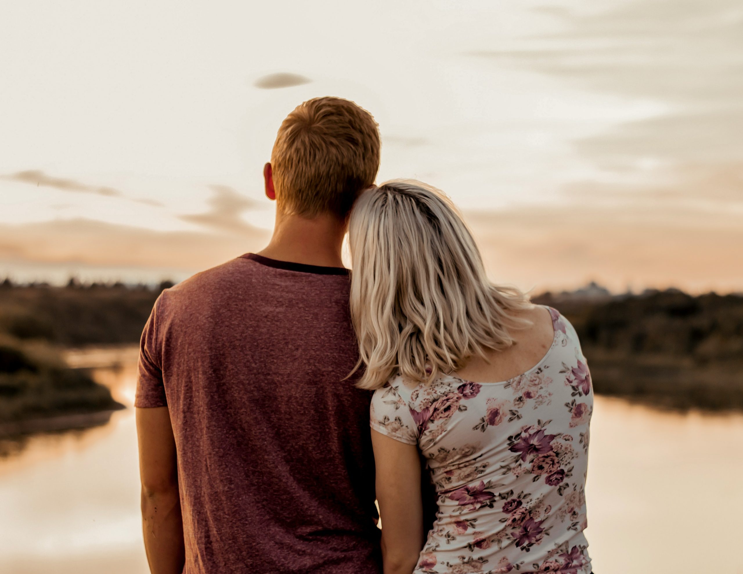 couple standing together at sunset representing secure attachment style and healthy relationship